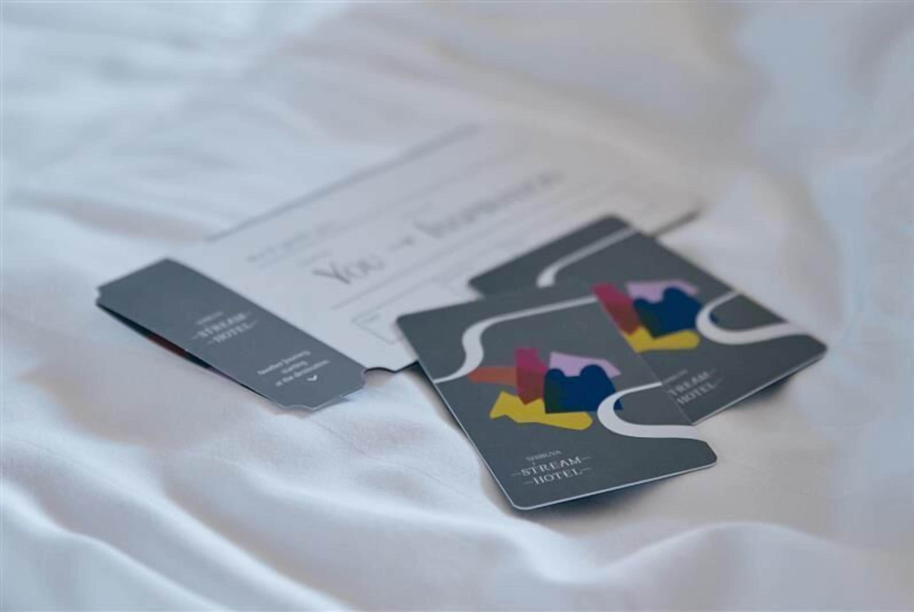 A hotel brochure with a modern design, featuring a stylized cityscape and the hotel's name.
