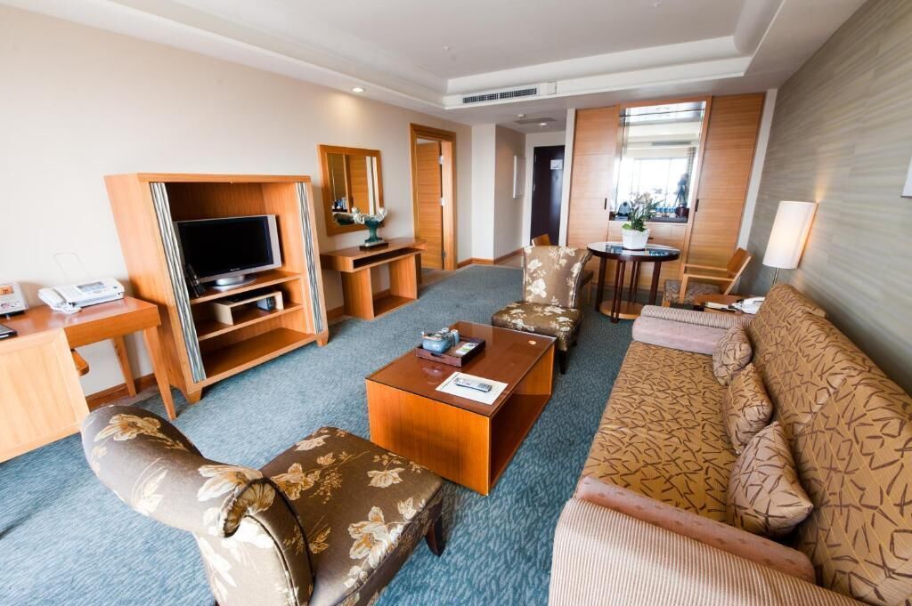 premium suite | in-room safe, desk, laptop workspace, blackout curtains
