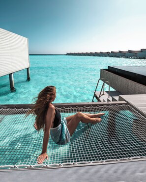 Overwater Pool Villa - Lagoon | Memory foam beds, minibar, in-room safe, individually decorated