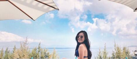 Outdoor pool, open 6 AM to 10 PM, sun loungers