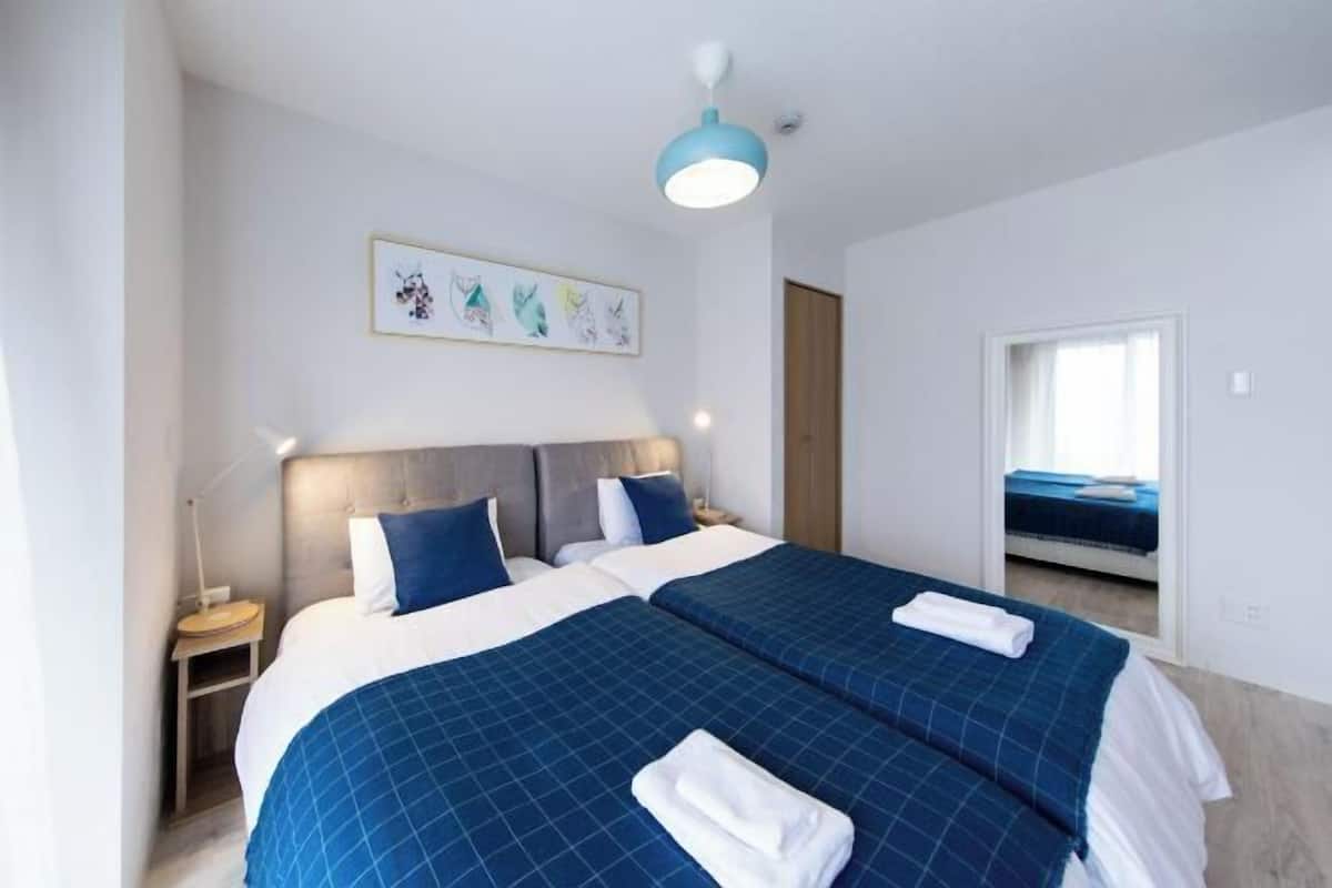 Desk, laptop workspace, blackout curtains, free WiFi