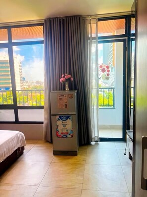 Deluxe With Balcony | Desk, blackout curtains, soundproofing, free WiFi - AHA Central Hotel and Residence (Ho Chi Minh City)