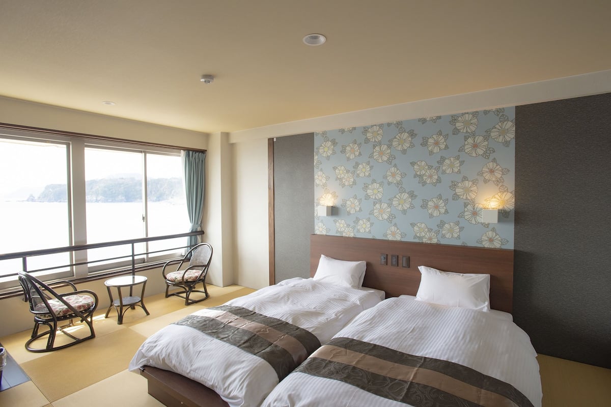 standard twin room, 2 single beds, non smoking, ocean view | 1 bedroom, down duvets, in-room safe, blackout curtains