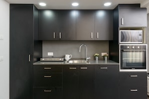 Luxury Apartment, Multiple Beds, Non Smoking | Private kitchen | Full-size fridge, microwave, oven, stovetop