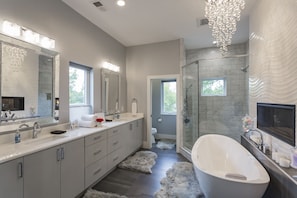 Combined shower/tub, hair dryer, towels, soap