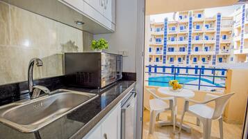 Pool View, Balcony, Kitchenette, Washing Machine | Tiba Resort E4 | Balcony view
