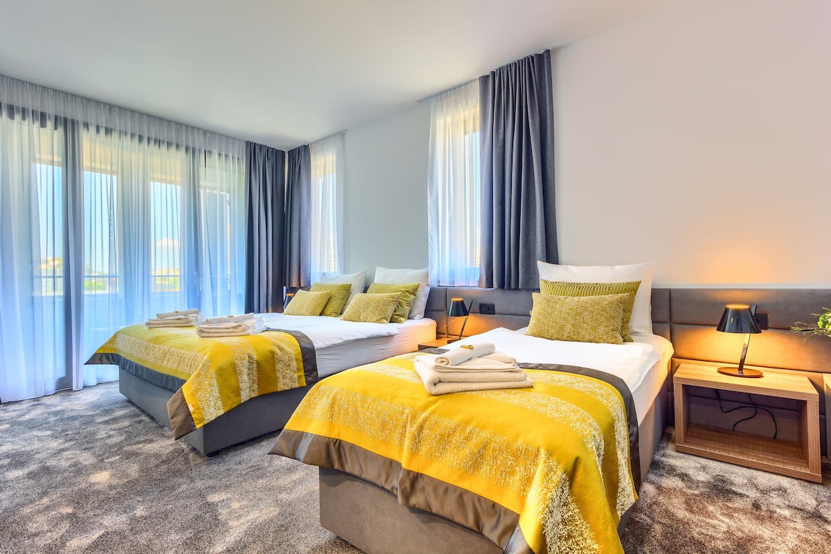 Deluxe-Dreibettzimmer | Wohnzimmer