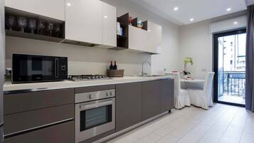 Deluxe Apartment | Private kitchen | Fridge, oven, stovetop, espresso maker