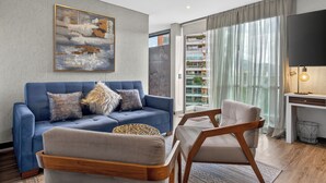 Suite | Oppholdsområde | En 50-tommers Flatskjerm-TV med kabel-kanaler samt TV