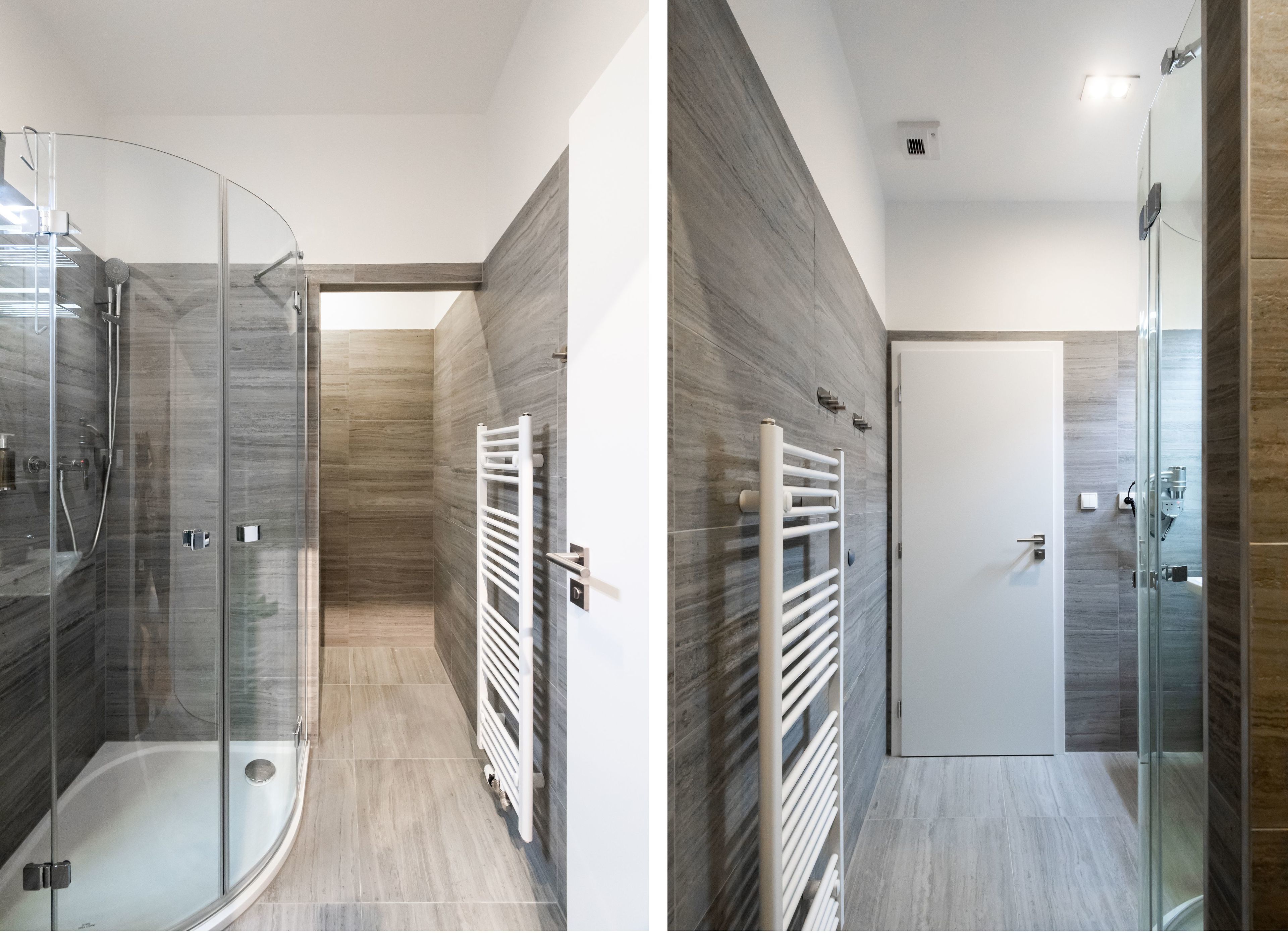 Une salle de bain moderne avec une douche à parois de verre, un porte-serviettes blanc et une porte donnant sur une autre pièce.
