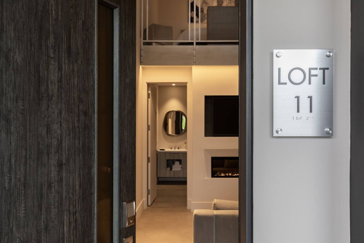 A modern interior with a sign reading "LOFT 11".