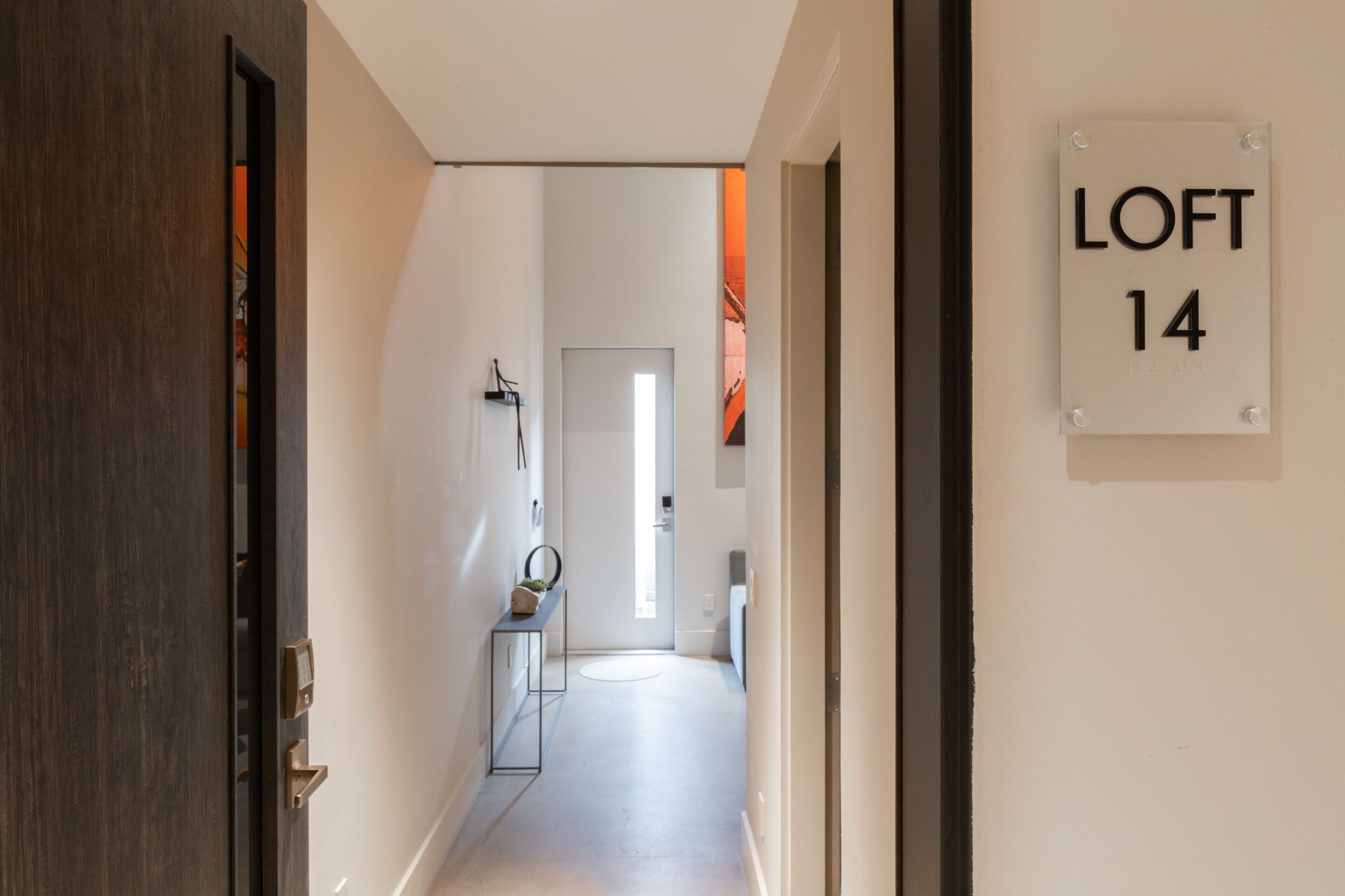 A hallway with a sign indicating 'LOFT 14'.