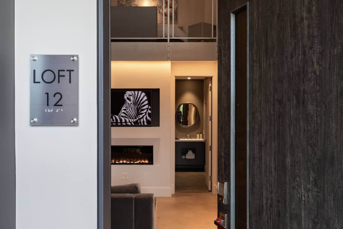 A modern interior with a sign reading "LOFT 12".