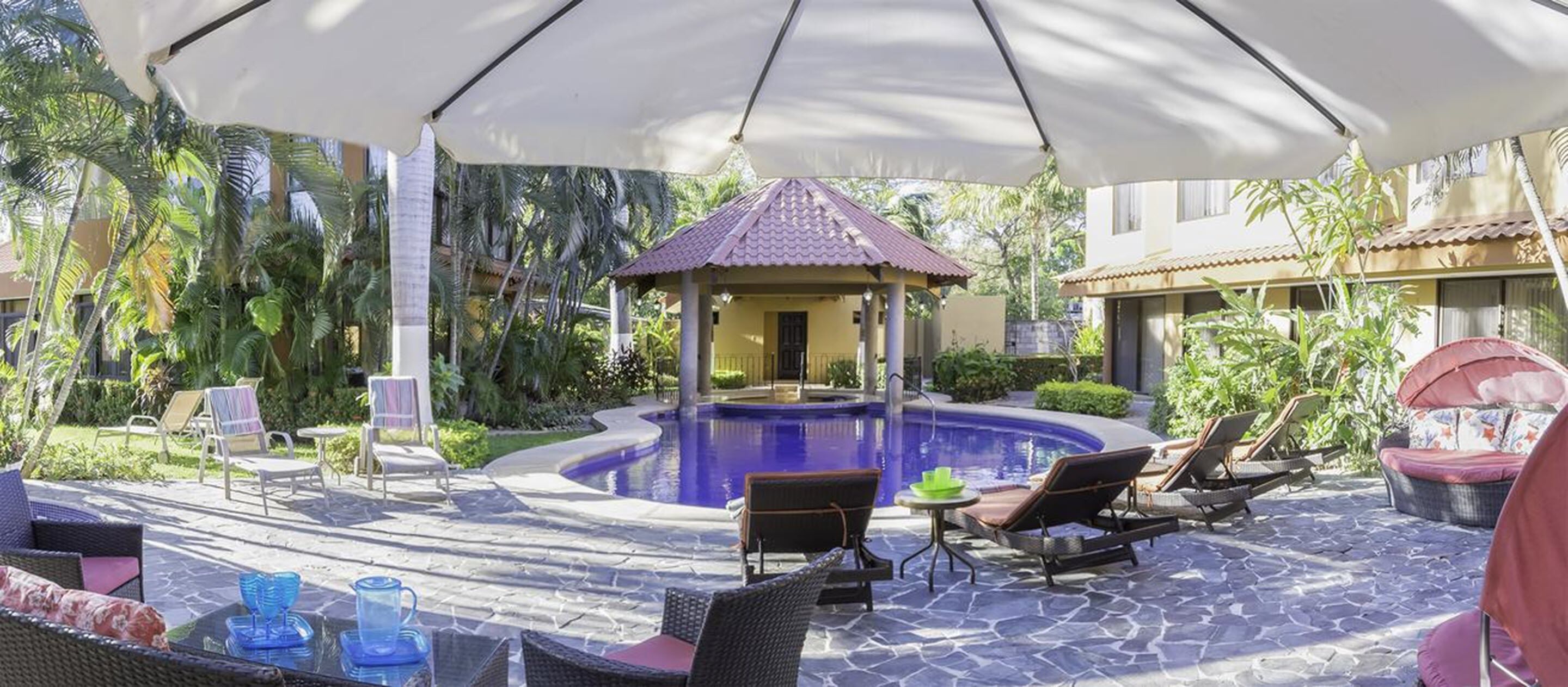 outdoor pool, pool umbrellas, pool loungers