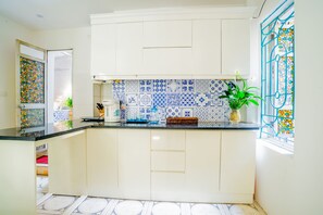 Apartment, 2 Bedrooms | Private kitchenette | Fridge, stovetop, electric kettle, rice cooker