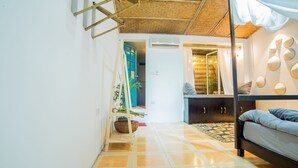 A bedroom with a bed, a wardrobe, a bedside table, a mirror, and a window. - Endless Love House in Old Quarter Hanoi (Hanoi)