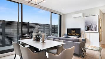 Deluxe Apartment, 1 Bedroom | Living area | 42-inch flat-screen TV with satellite channels, LCD TV, DVD player
