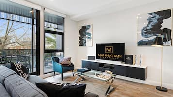 Deluxe Apartment, 2 Bedrooms | Living area | 42-inch flat-screen TV with satellite channels, LCD TV, DVD player