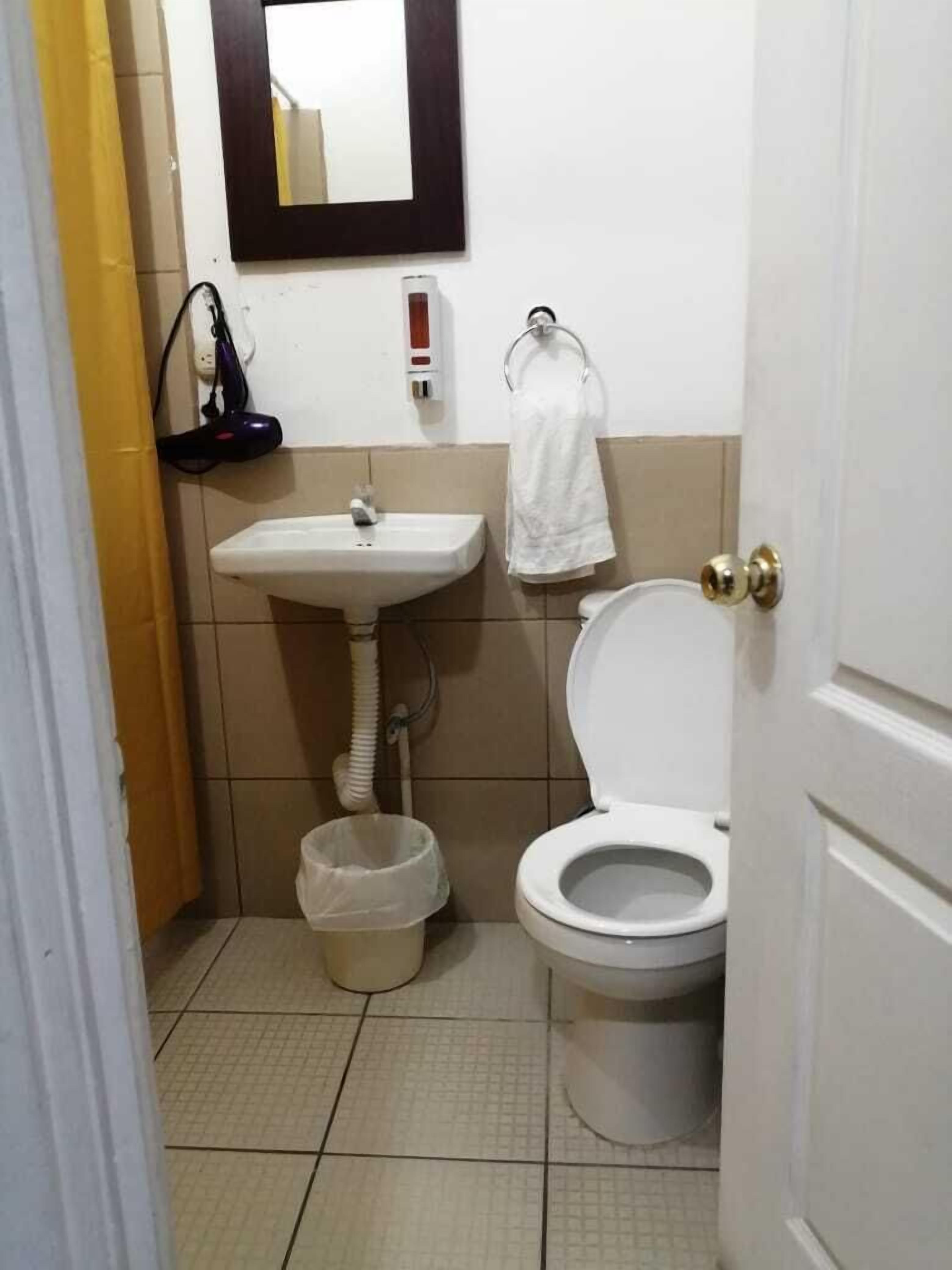 economy double room, 2 double beds, non smoking, ensuite | bathroom | shower, rainfall showerhead, free toiletries, hair dryer