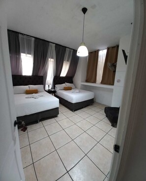 Economy Double Room, 2 Double Beds, Non Smoking, Ensuite | Free WiFi, bed sheets - Global Airport Inn Guatemala (Guatemala City)