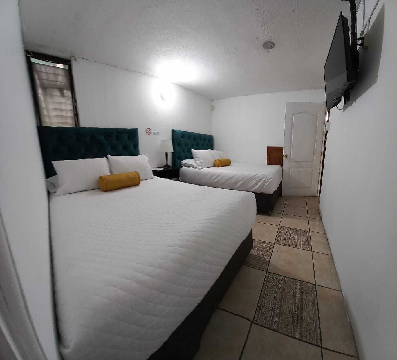 economy quadruple room, 2 double beds, non smoking, private bathroom | free wifi, bed sheets