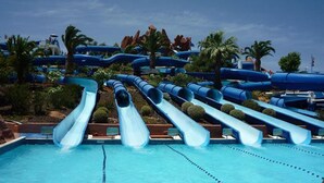 A water park with multiple water slides and a swimming pool. - Torralta Alvor Beach 601 (Alvor)