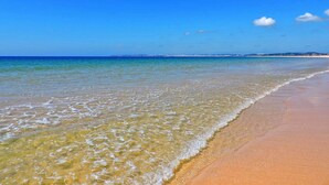 A beach with clear water and a sandy shore. - Torralta Alvor Beach 601 (Alvor)