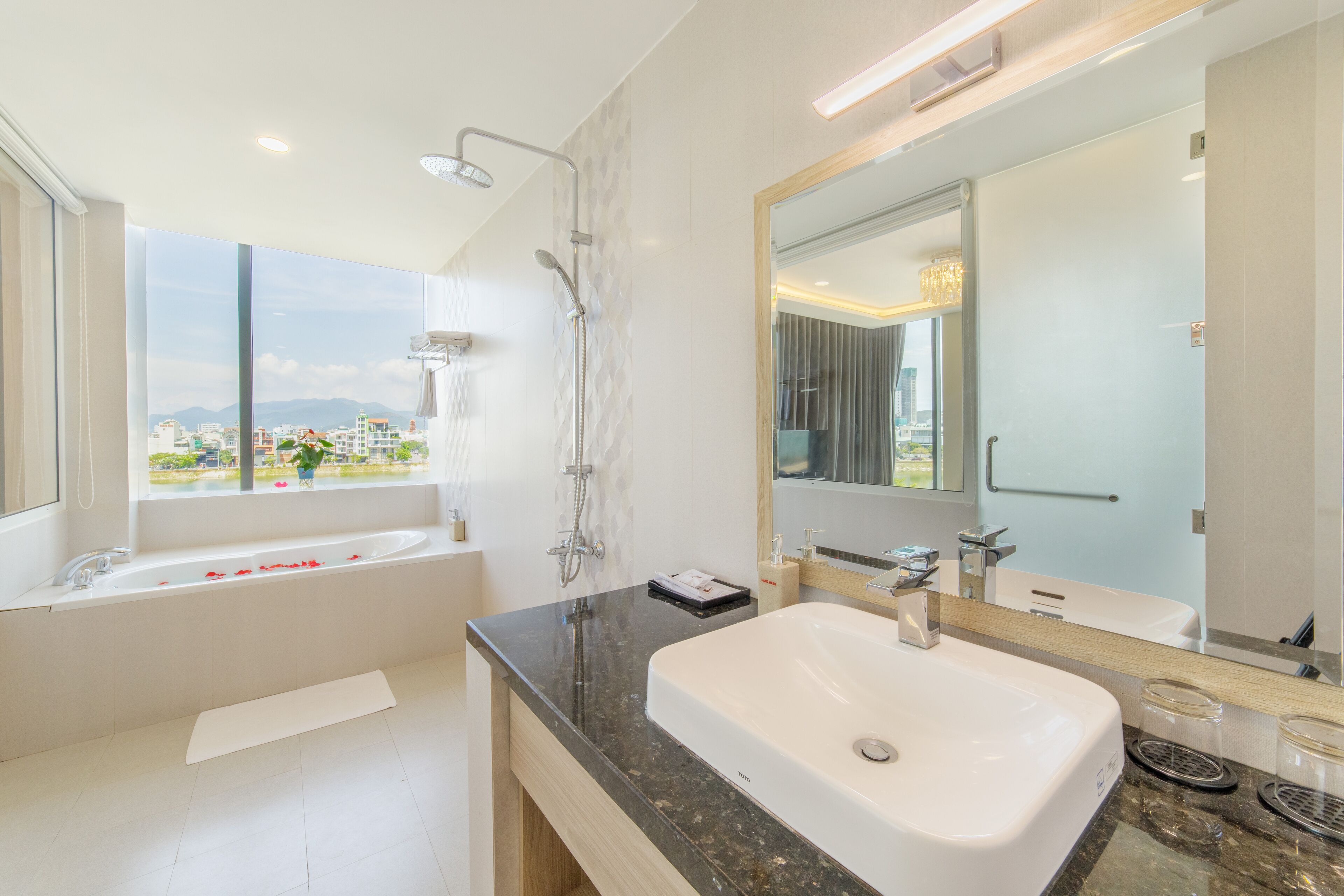 luxury room, 1 king bed, lake view | bathroom | free toiletries, hair dryer, bathrobes, slippers