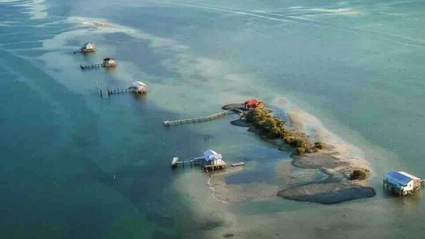An aerial view of a coastal area with several small islands connected by bridges. - NEW!! The “WATERSIDE” COTTAGE~With dockage (Bokeelia)