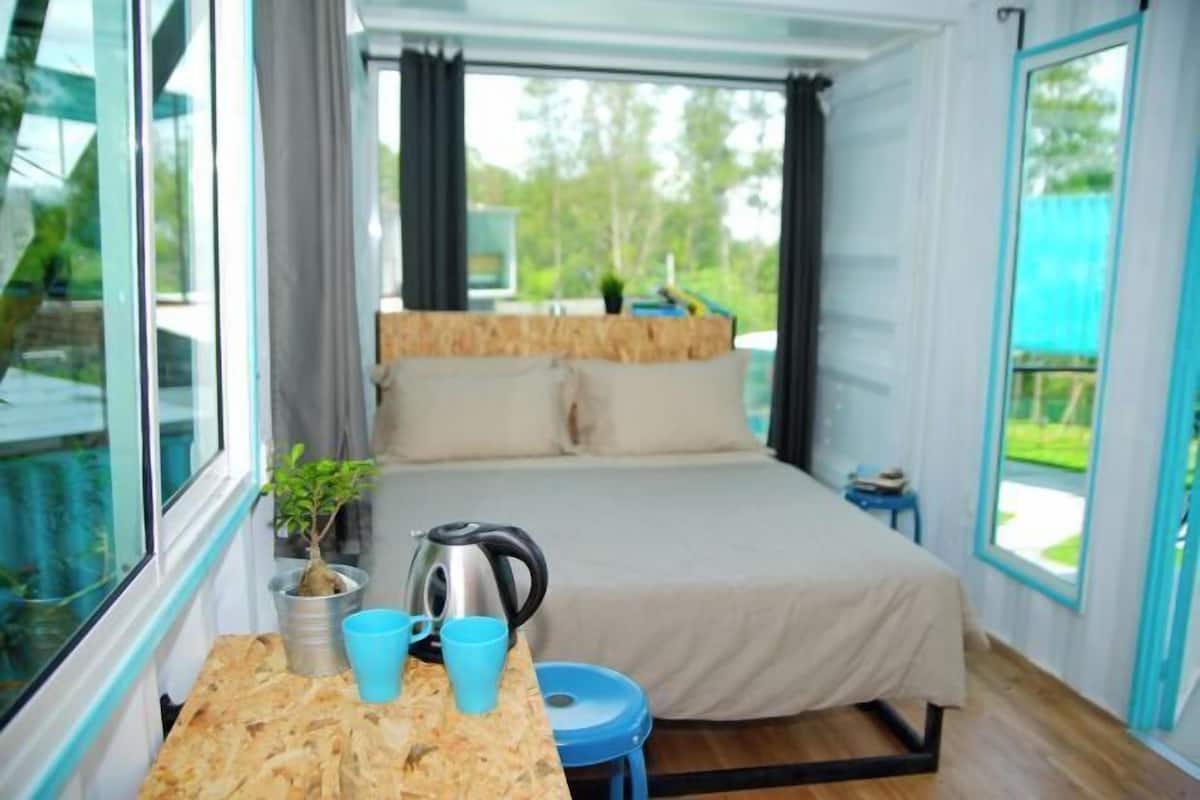 Desk, iron/ironing board, bed sheets