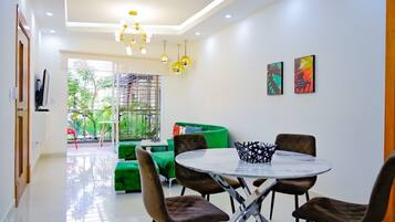 Exclusive Apartment, 3 Bedrooms, Non Smoking | Living area | 32-inch Smart TV with cable channels, TV, Netflix