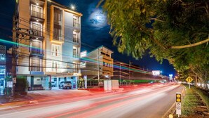 A multi-story building with a ground-level entrance and a visible signboard. - Phusamor Hotel (Trang)
