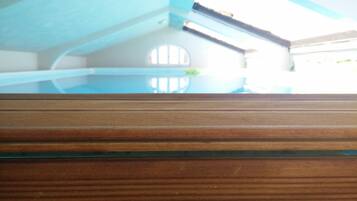 A wooden floor with a glass panel.