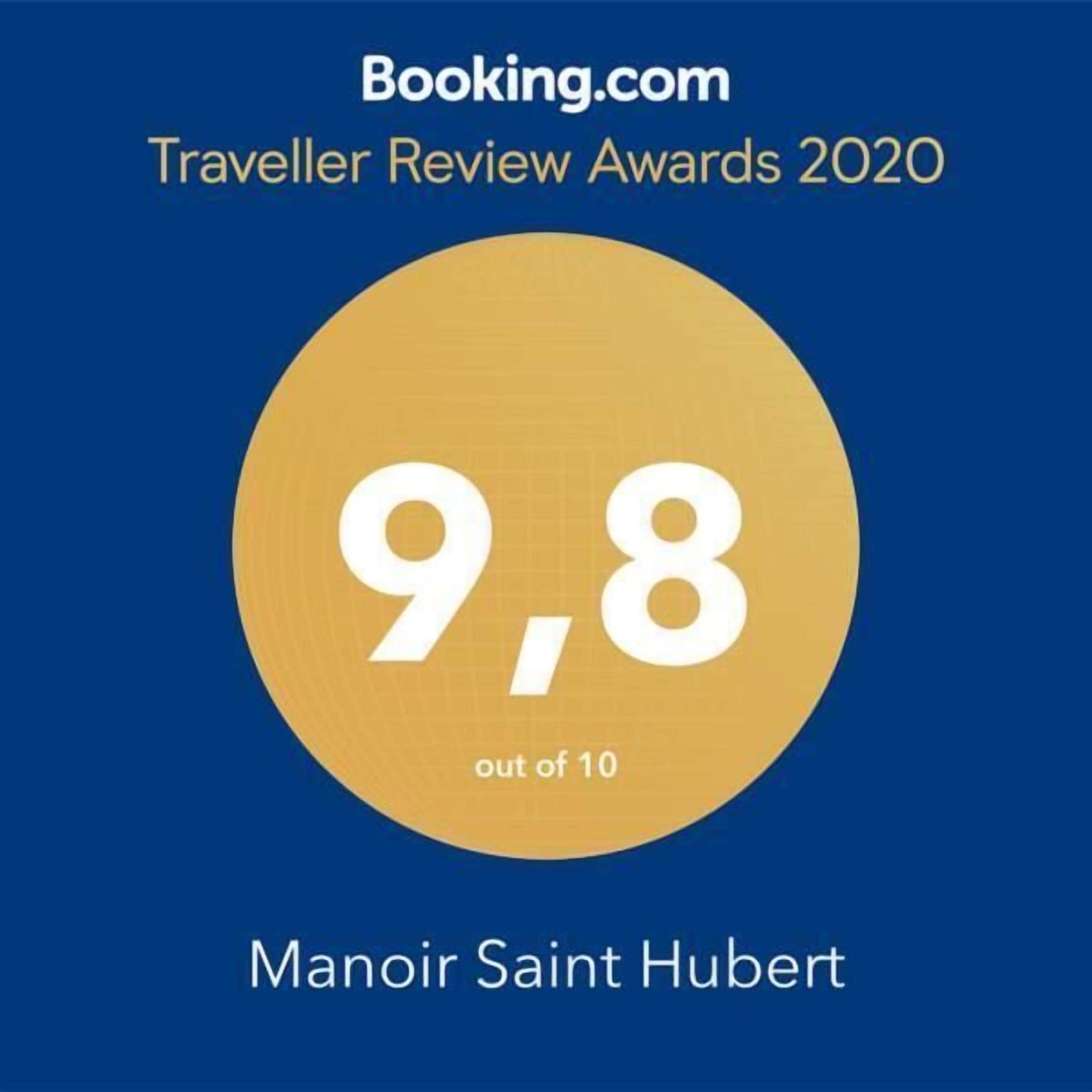 A circular badge with the number 9.8 and the text "out of 10" indicating a rating, and the name "Manoir Saint Hubert" below it.