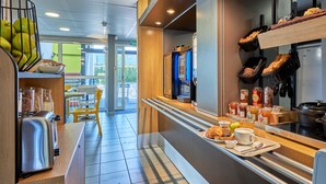A modern breakfast bar with a toaster, bread baskets, and condiments.