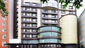 A multi-story hotel with a curved glass facade and a prominent cylindrical structure on the right. - Chengdu Tianfu Pretty Hotel (Chengdu)