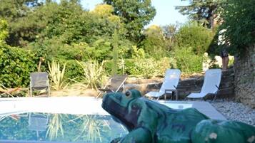 Outdoor pool, a heated pool, sun loungers