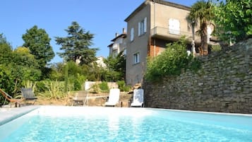 Outdoor pool, a heated pool, sun loungers