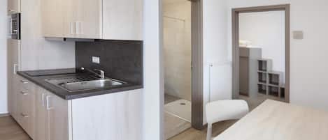 Apartment, Balcony | Private kitchen | Full-sized fridge, microwave, stovetop, cookware/dishes/utensils