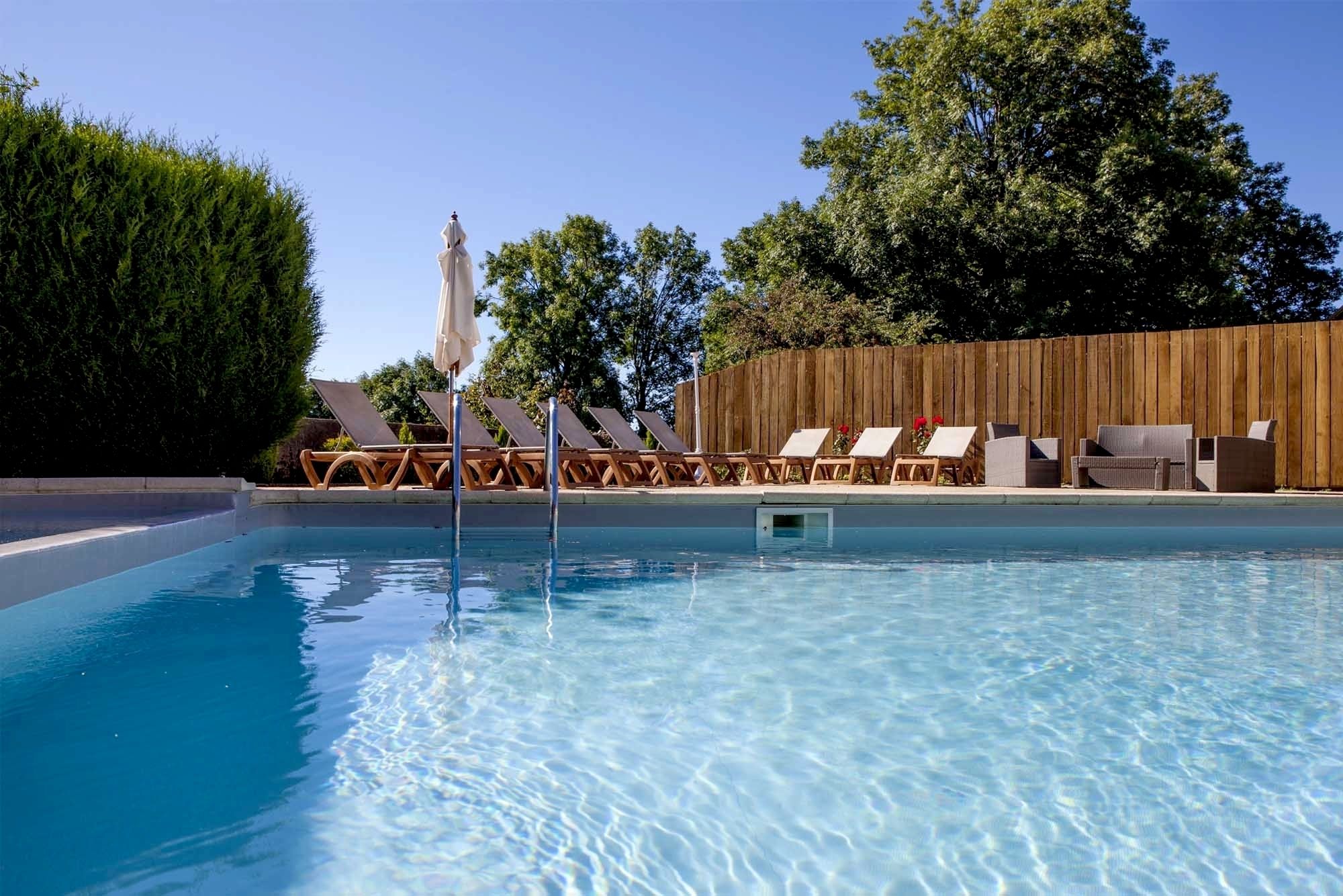 outdoor pool, pool umbrellas, pool loungers