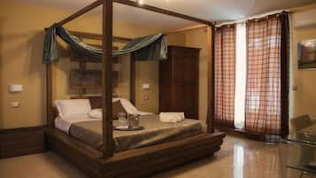 Suite, 1 King Bed, Jetted Tub | Minibar, in-room safe, desk, soundproofing