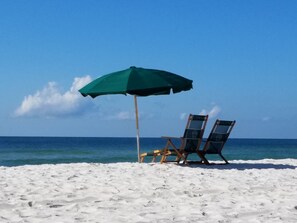 On the beach, sun-loungers