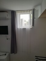 Economy Triple Room, 1 Bedroom, Ground Floor (Basement) | Iron/ironing board, free cribs/infant beds, free WiFi