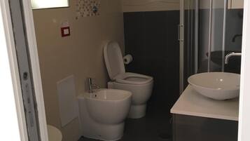 Un baño moderno con inodoro, bidé y dos lavamanos.