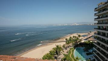 On the beach, sun loungers, beach towels
