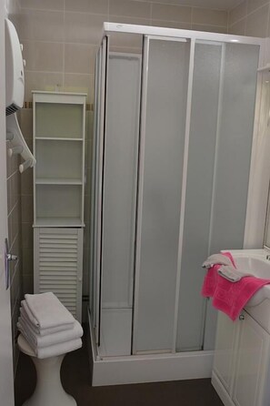 Shower, free toiletries, hair dryer