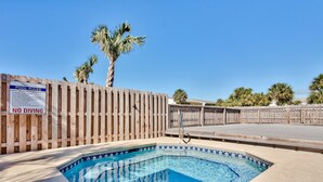 A pool with a wooden fence and a 'No Diving' sign, surrounded by palm trees. - 2min Walk to Private Beach! 3BR Gorgeous Townhome! (Miramar Beach)