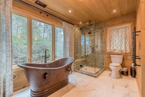 Bathtub, hair dryer, towels, soap
