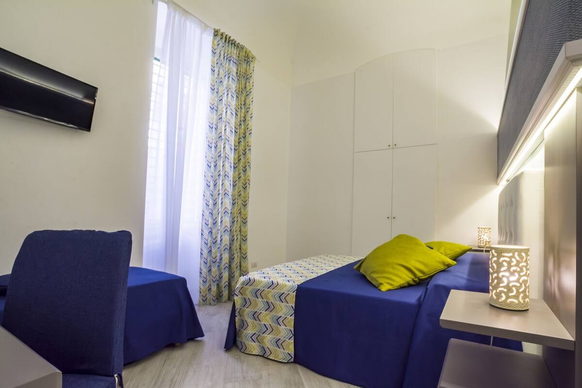 Exclusive Quadruple Room, Private Bathroom, City View | Memory-foam beds, minibar, in-room safe, desk