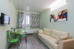 Appartement, 1 chambre | Aire de séjour | Téléviseur à écran plat